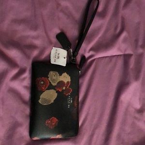 A black and red coach wristlet